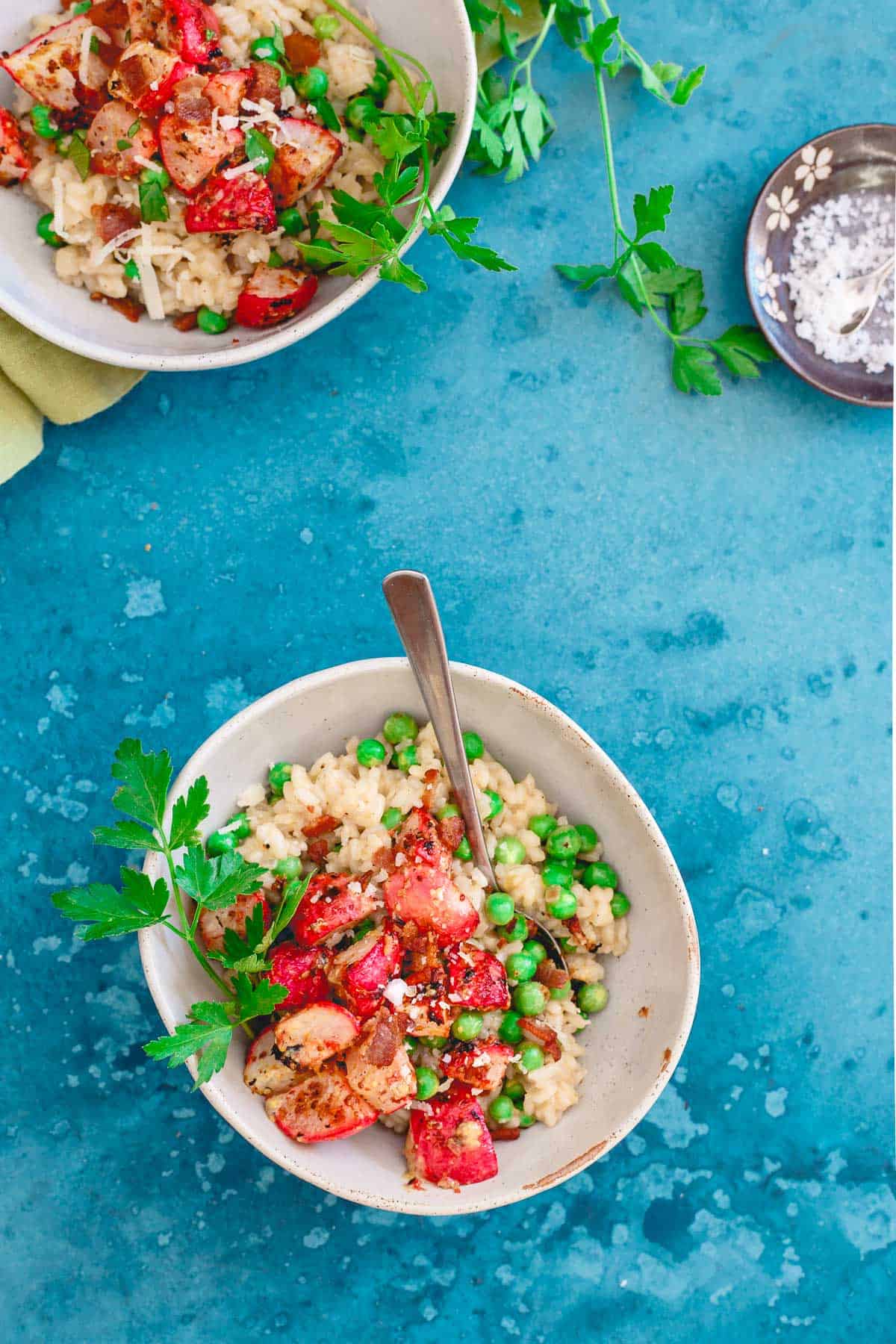 Citrus infused creamy arborio rice is tossed with fresh spring peas and Meyer lemon dijon roasted radishes. Topped with crumbly bacon and freshly grated parmesan, this is risotto is spring comfort food at its best!