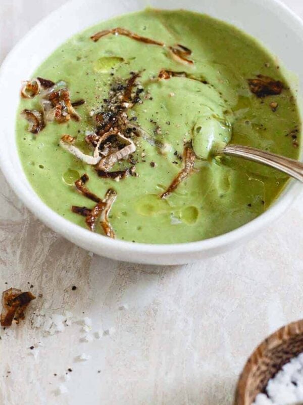 This easy creamy broccoli soup is rich, comforting and topped with crispy shallots. It's also paleo, gluten free, vegetarian and vegan.