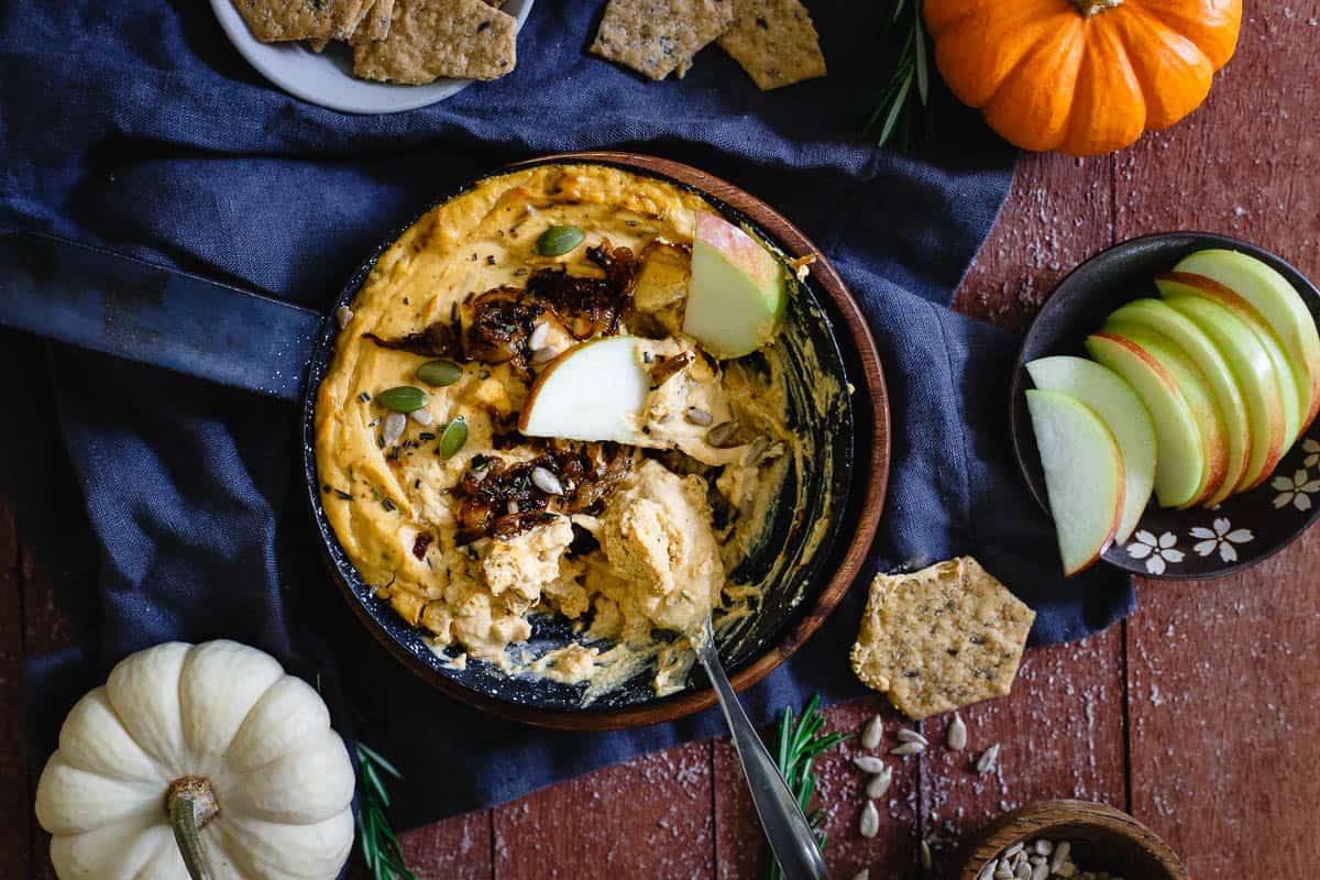 Creamy, savory, tangy and perfect for any appetizer spread, this pumpkin goat cheese dip with caramelized onions can be served hot or cold!