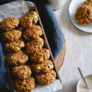 These healthy carrot cake cookies made with oats and whole wheat flour are packed with raisins, walnuts, lemon zest and ginger. Drizzle them with the optional almond butter cream cheese topping for a true creamy carrot cake like bite. No added sugar, no butter, still completely delicious and guilt-free.