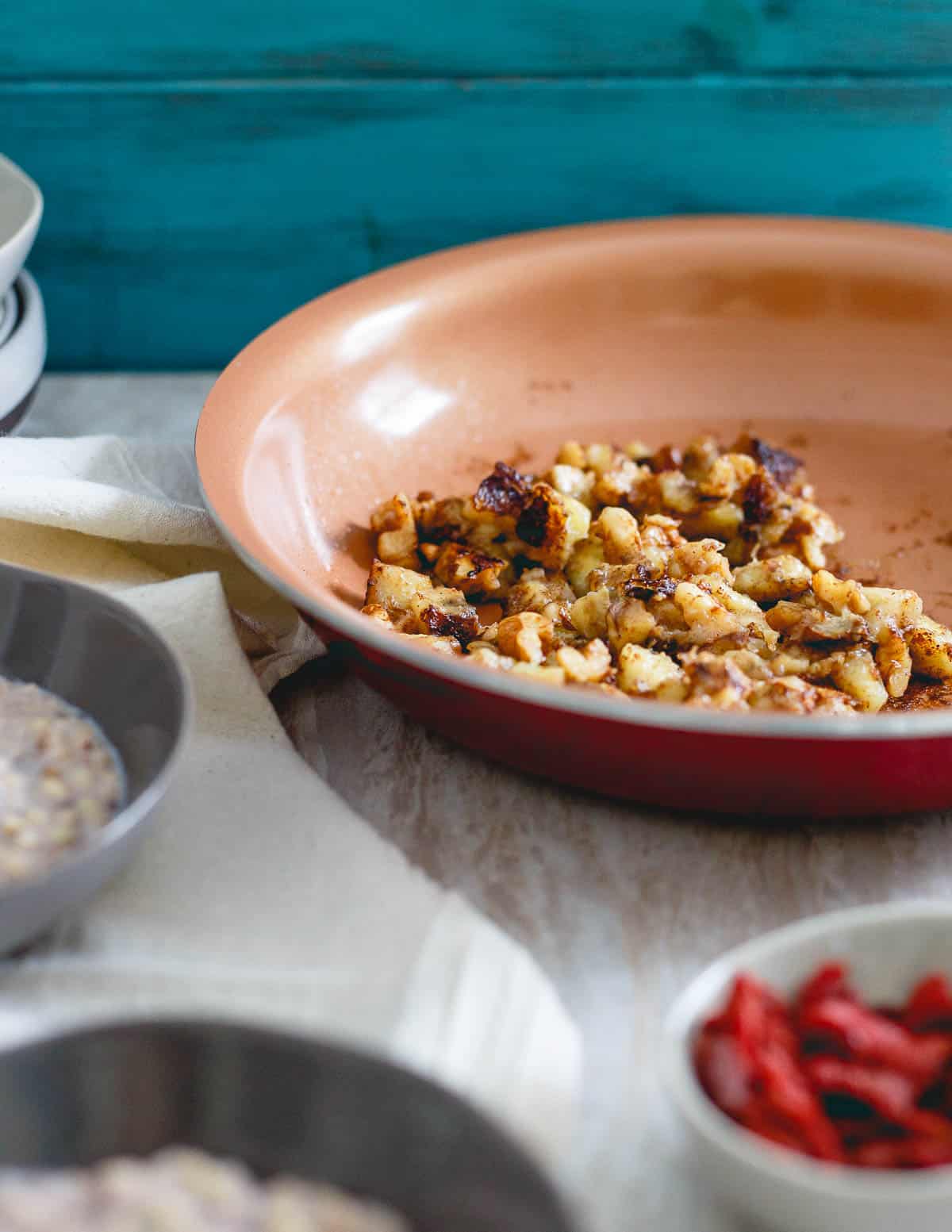 A simple caramelized banana walnut topping makes this warm quinoa cereal a delicious bowl for breakfast.