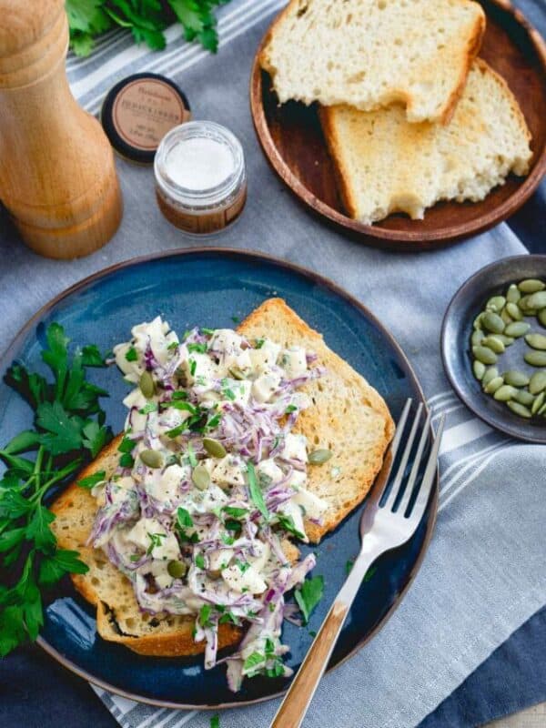 A plate of bread with a salad on it.