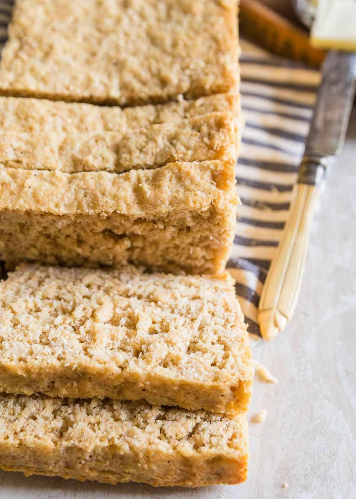 Easy homemade oat bread sliced on a kitchen towel.