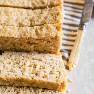 Easy homemade oat bread sliced on a kitchen towel.