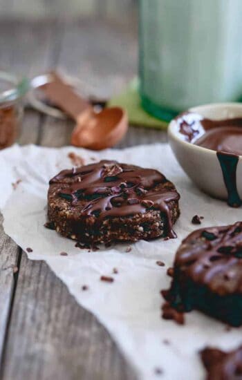 Raw brownie bites are a healthy way to satisfy a chocolate craving. Made with nuts, dried fruit and a chocolate drizzle, they're paleo, gluten-free and vegan dessert you can feel good about eating.