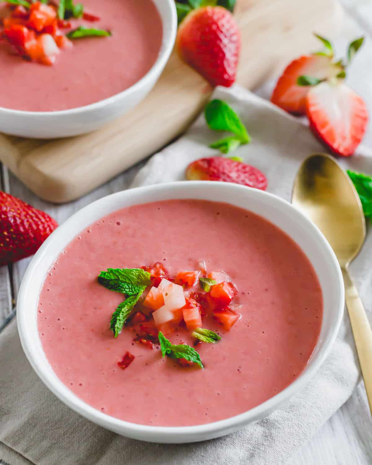 Cold strawberry soup in a white bowl.