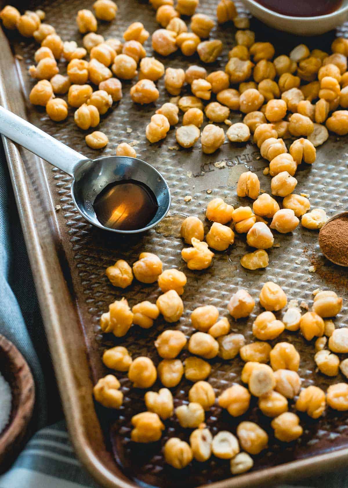 Roasting chickpeas with maple syrup and cinnamon produces a delicious snack that tastes just like Cinnamon Toast Crunch cereal!