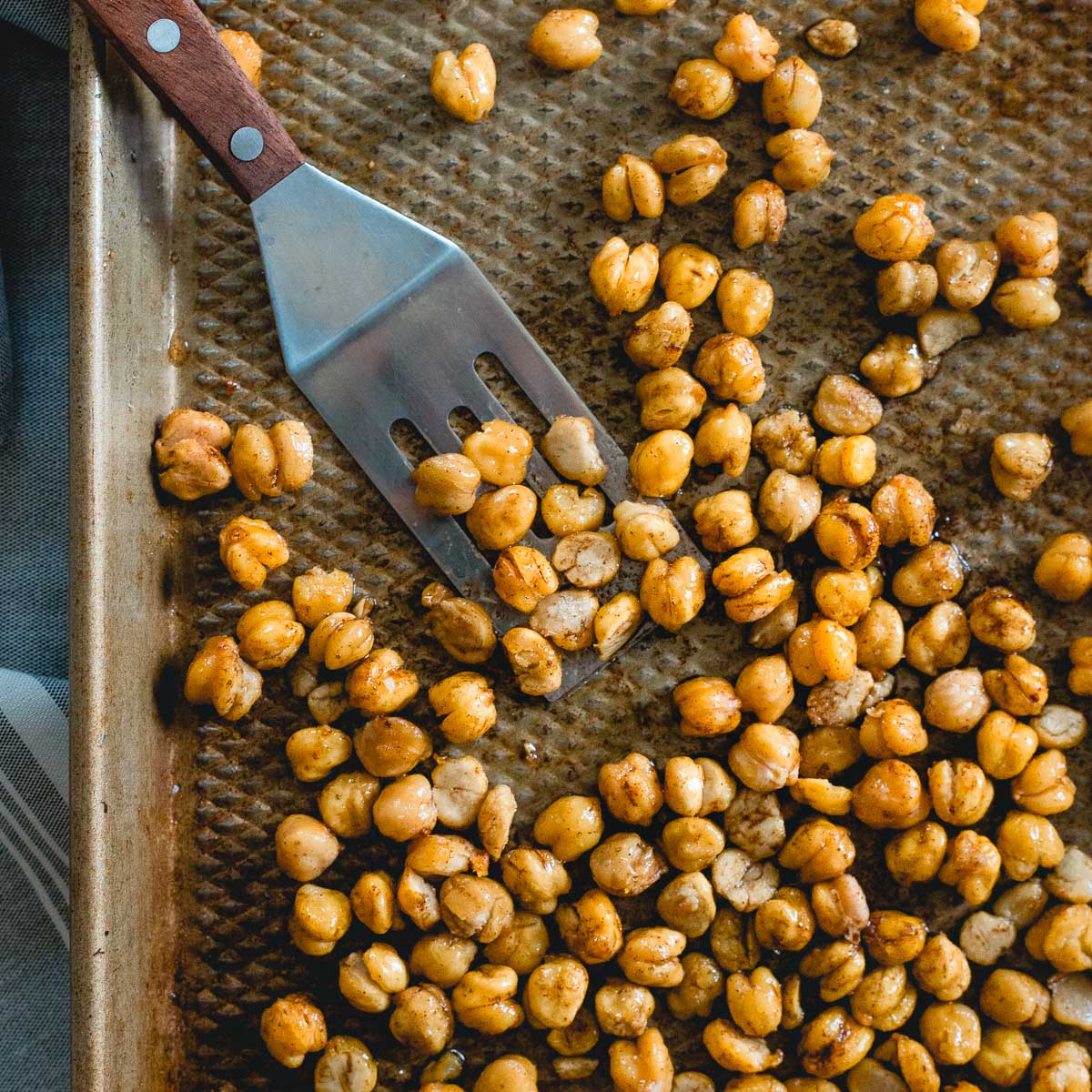 Follow this trick to get crispy roasted chickpeas every time, these cinnamon toast crunch chickpeas are the perfect healthy, sweet snack.