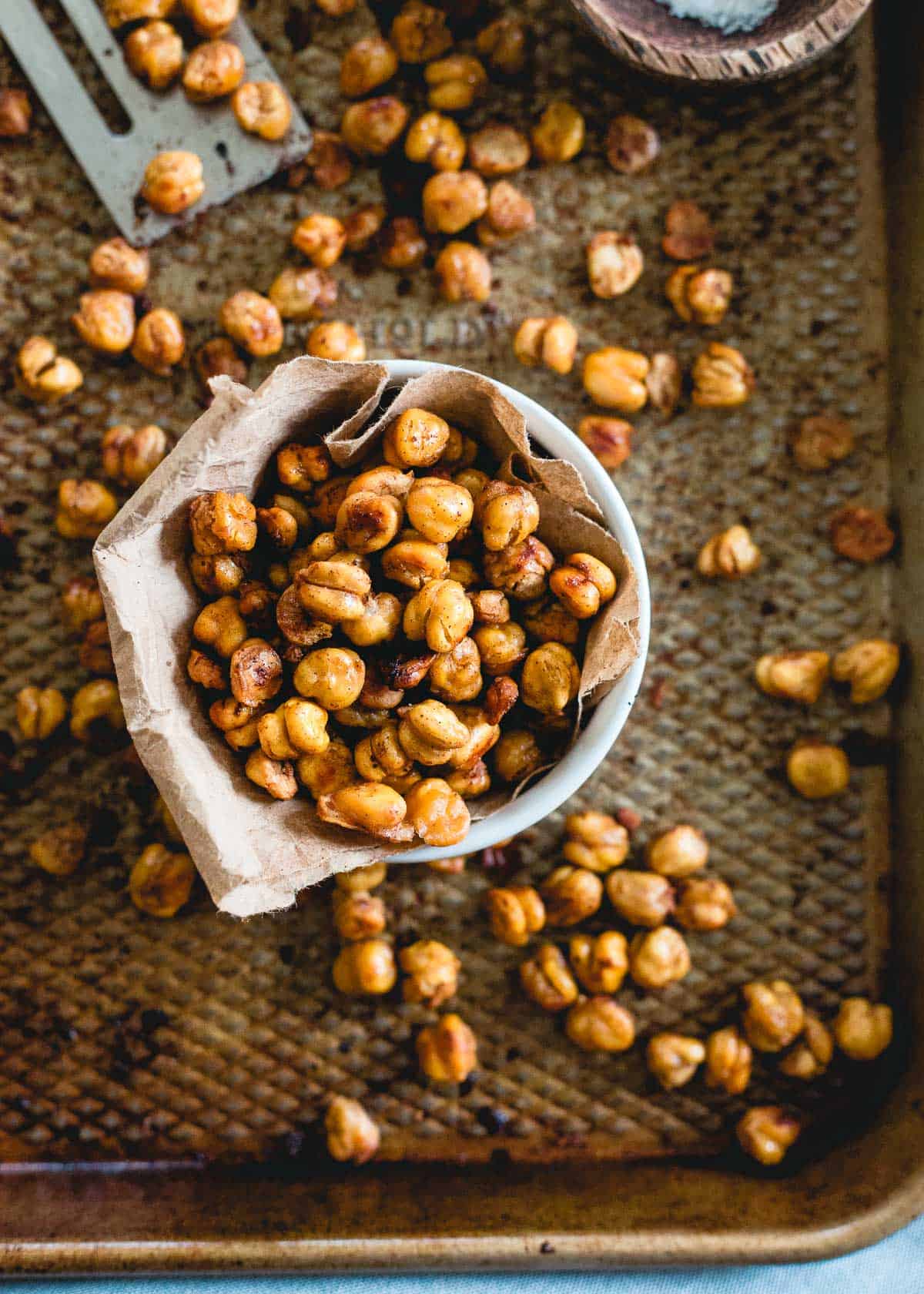 These cinnamon toast crunch roasted chickpeas taste just like the cereal. Made with maple syrup, coconut oil and cinnamon, they're a much healthier way to snack.