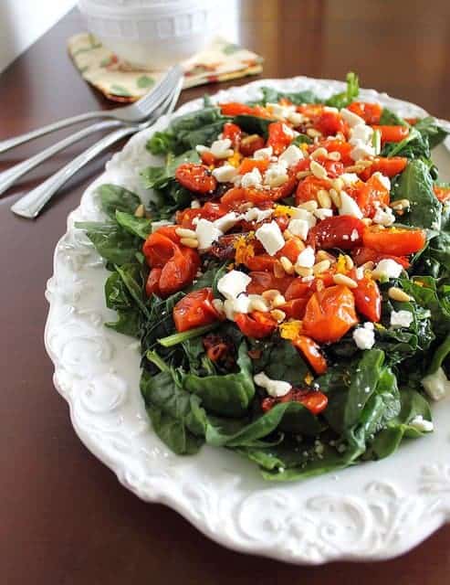 Roasted tomato spinach salad with citrus mustard vinaigrette