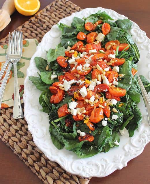 Roasted tomato spinach salad with citrus mustard vinaigrette