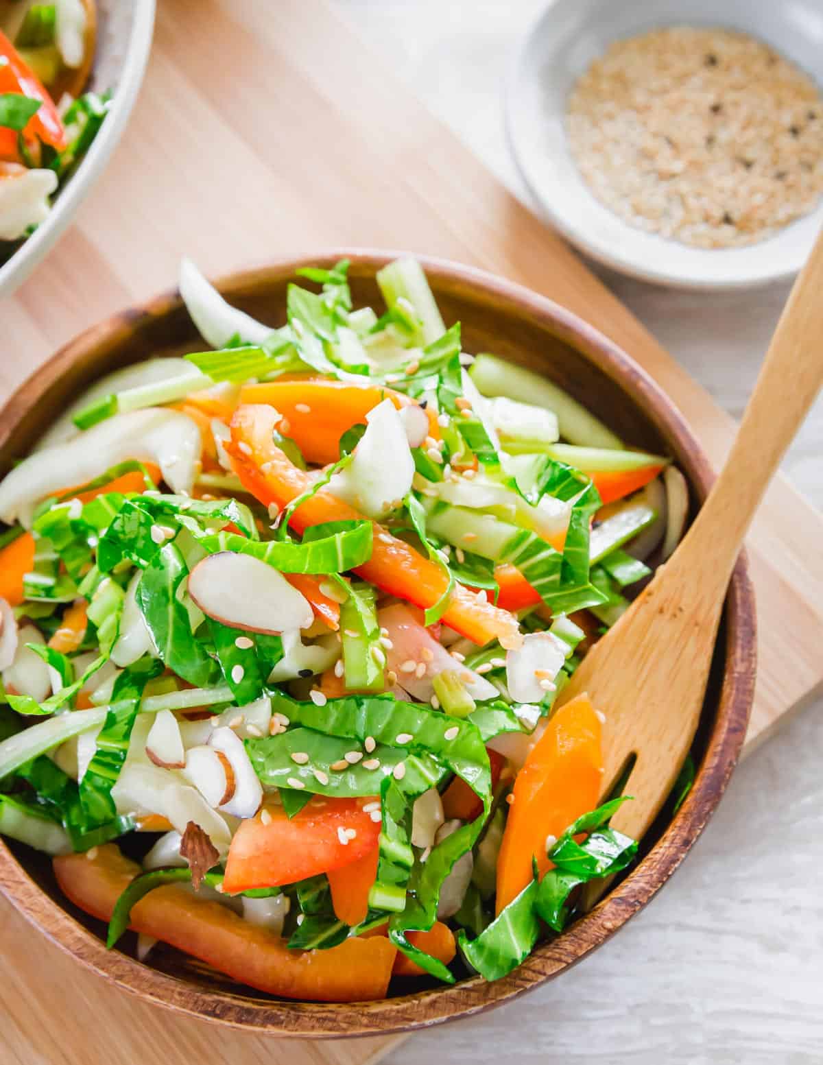 Baby bok choy salad with asian sesame soy dressing, sliced almonds and toasted sesame seeds