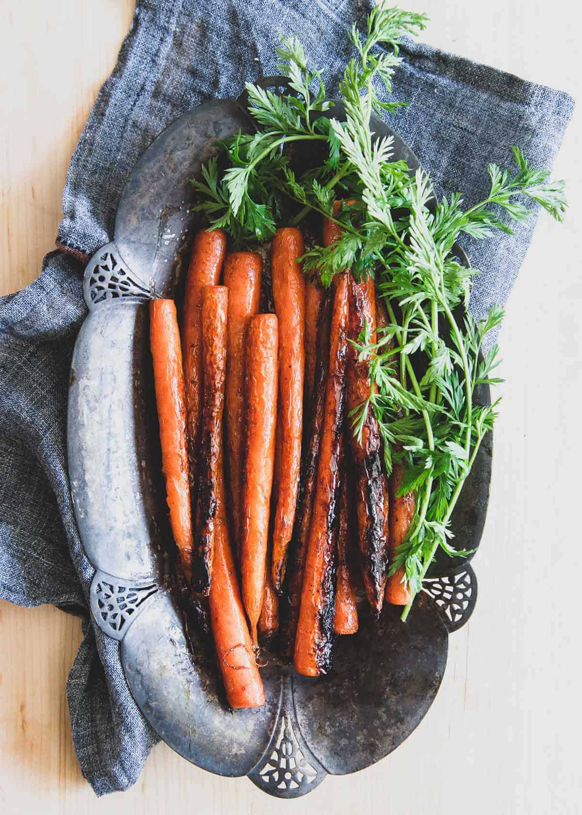 These caramelized candied carrots with brown sugar and butter taste just like candy and are a great tasty side dish to any dinner.