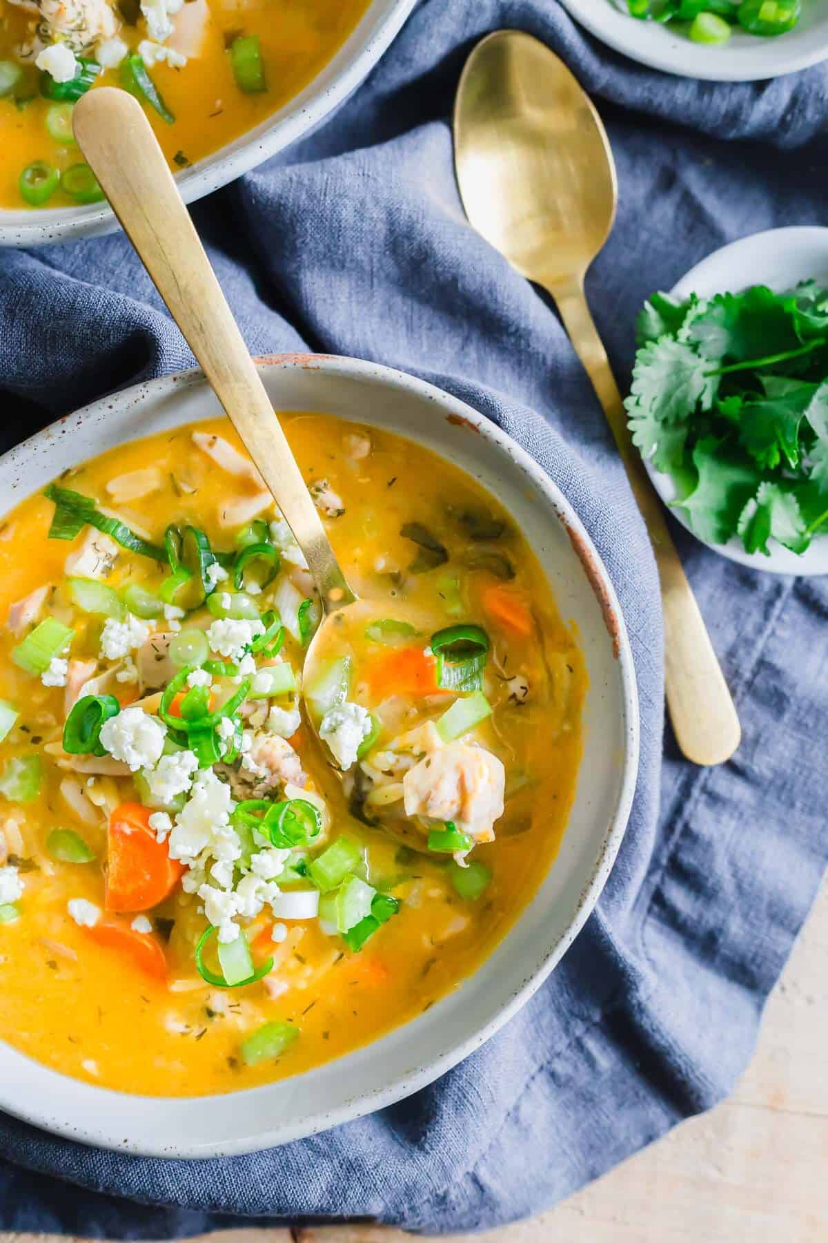 Creamy buffalo chicken soup with carrots and orzo.