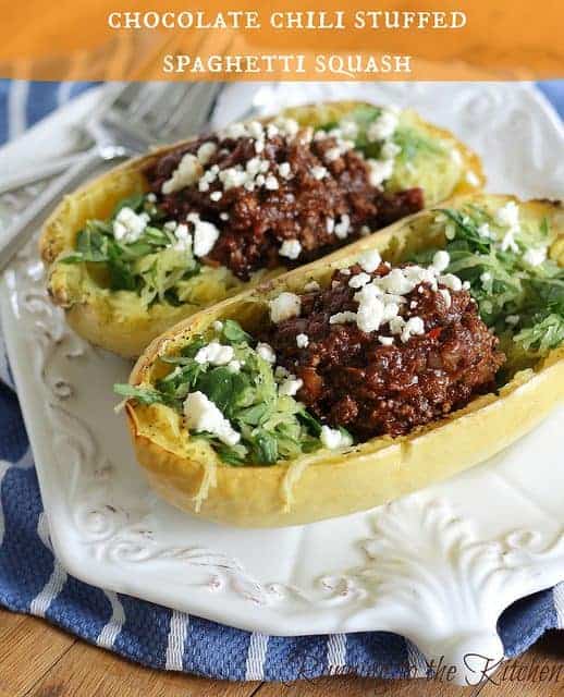 Chocolate chili stuffed spaghetti squash mixed with baby spinach and feta cheese is an indulgent yet healthy dinner and makes for great leftovers!