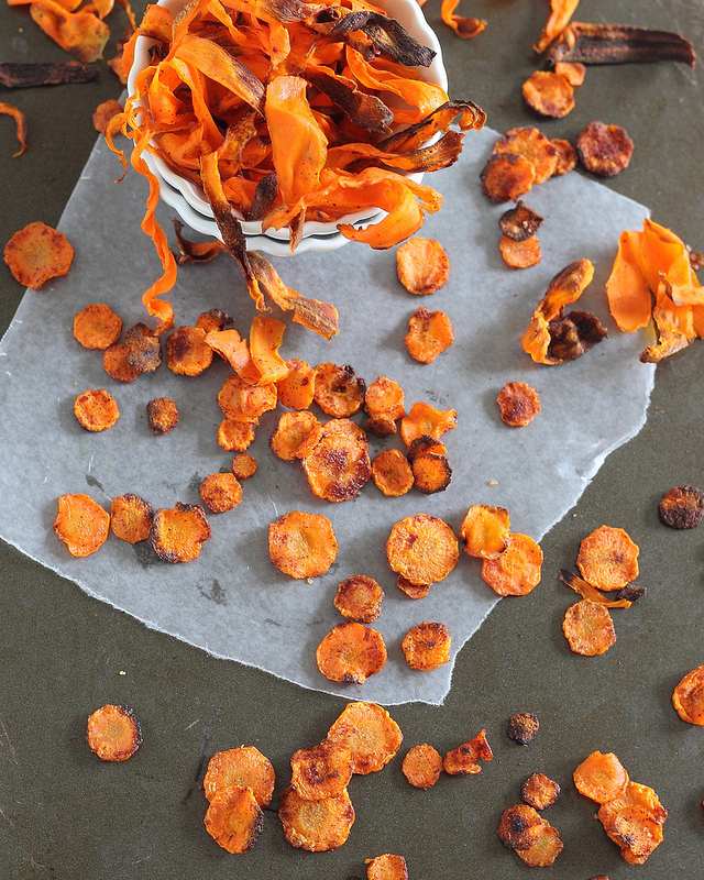 These crispy baked carrot chips are done two ways. One version is spicy, one is sweet. Both are a delicious and different way to eat your vegetables!