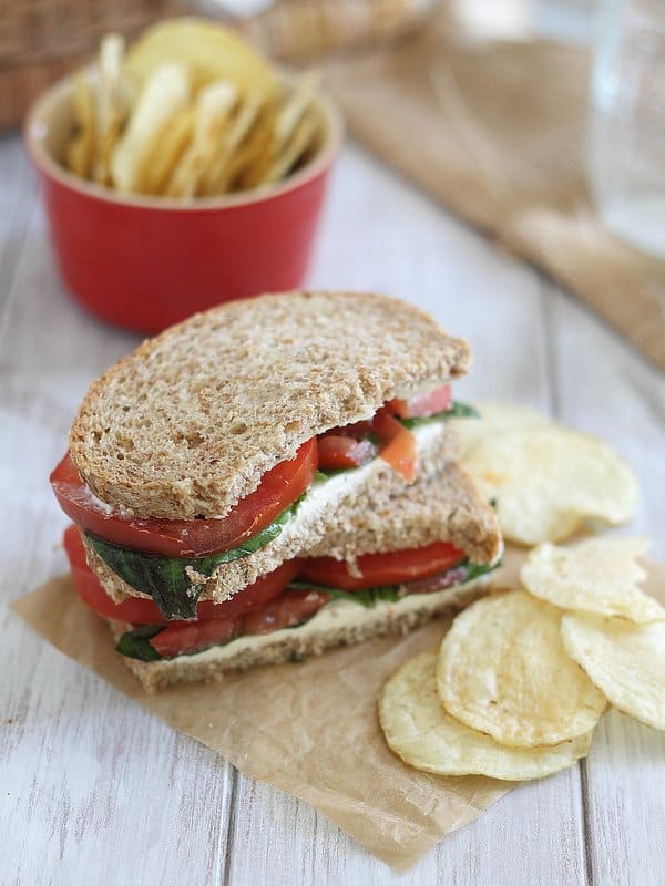 Cream cheese sandwich with tomatoes and basil