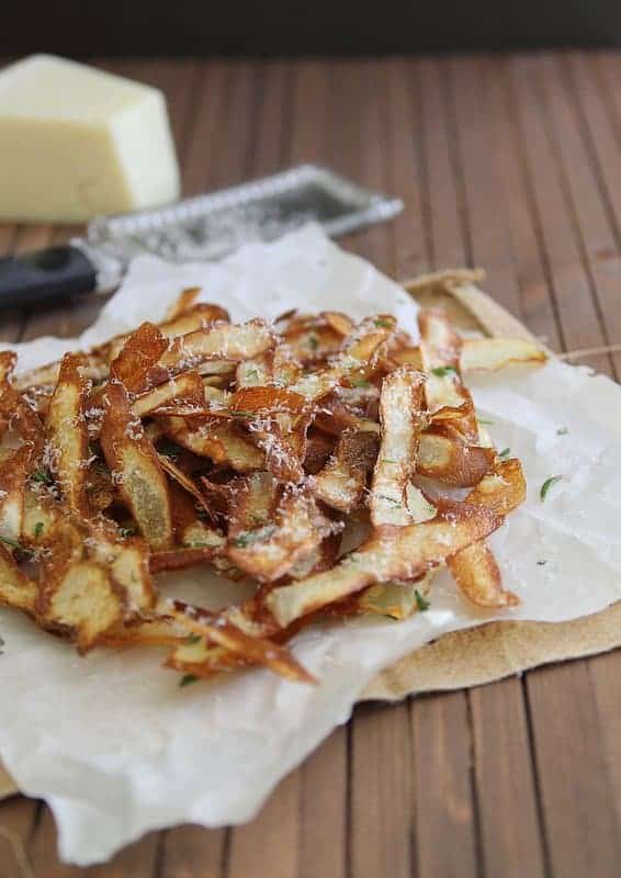fried potato strips with parmesan cheese and rosemary