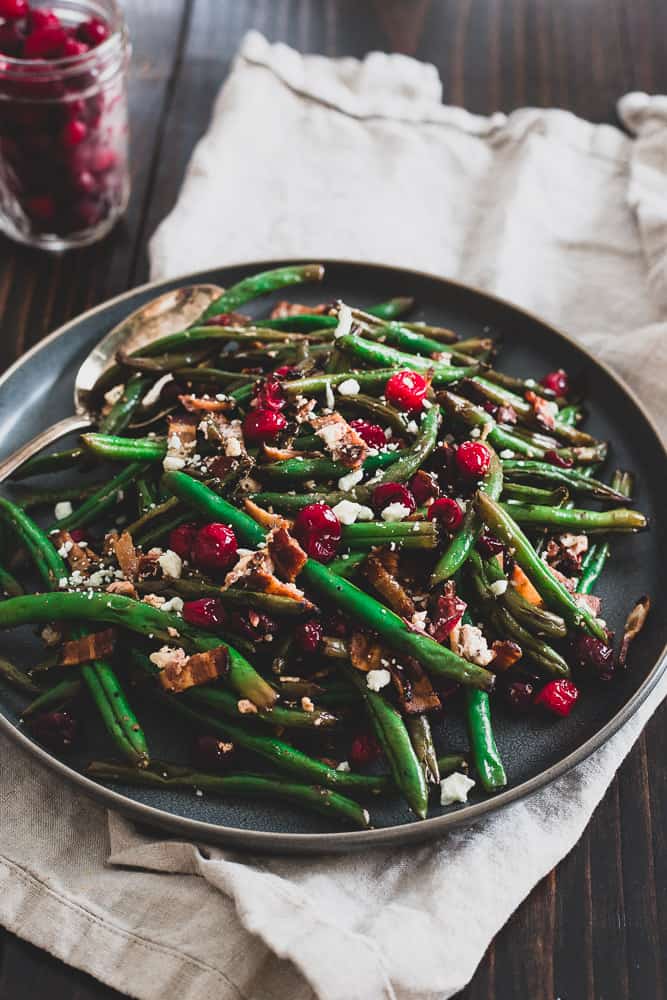 These green beans with cranberries, bacon and goat cheese are an explosion of flavor and a healthier take on traditional green bean side dishes for the holidays.