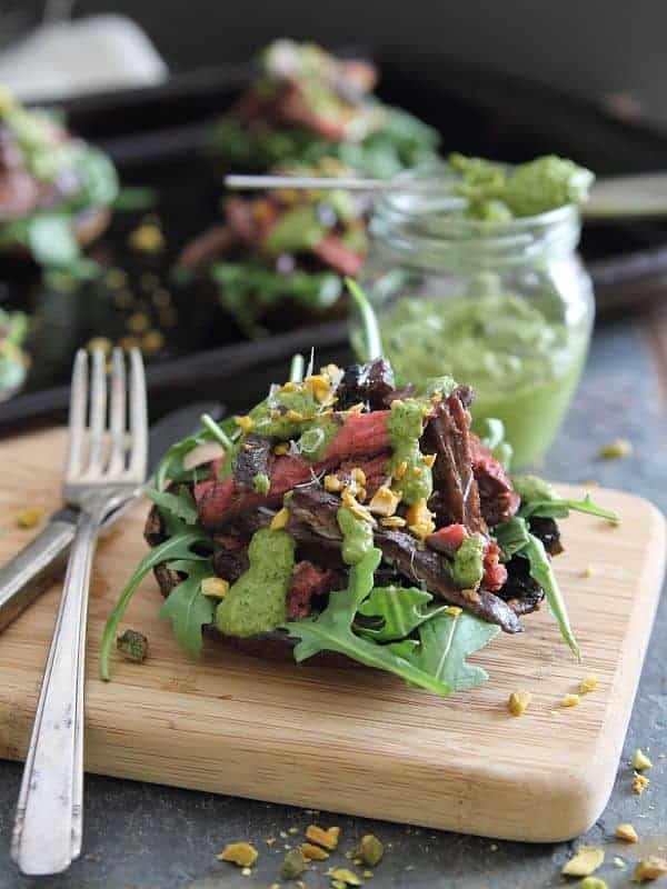 These balsamic steak stuffed portobellos are topped with a bright pistachio pesto and make for a delicious and fancy looking dinner!