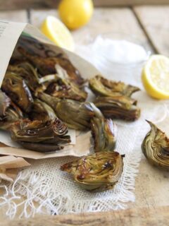 Roasted baby artichokes served with lemon and salt