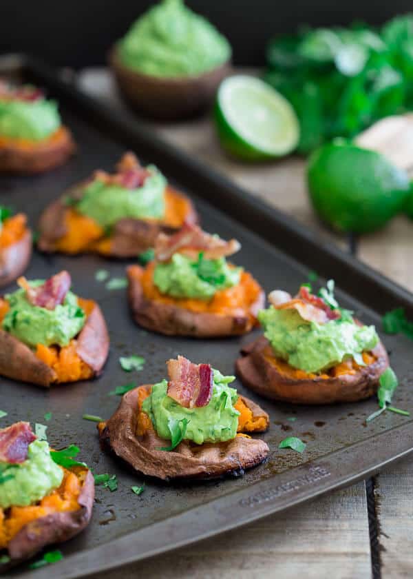 These smashed sweet potato guacamole bites have crispy sides with soft centers. Topped with a crispy piece of salty bacon, they're the perfect game day bite.
