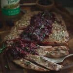 Flank steak with blackberry sauce.