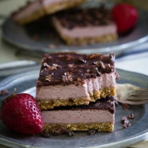 Strawberry cream bars on a plate.