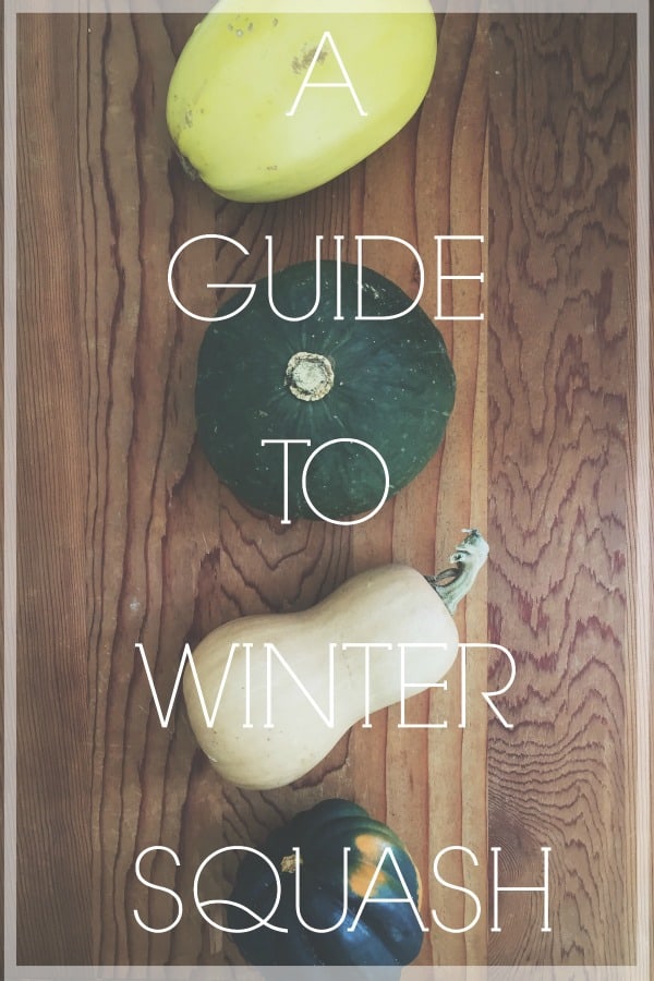 Winter squash on a wooden surface.