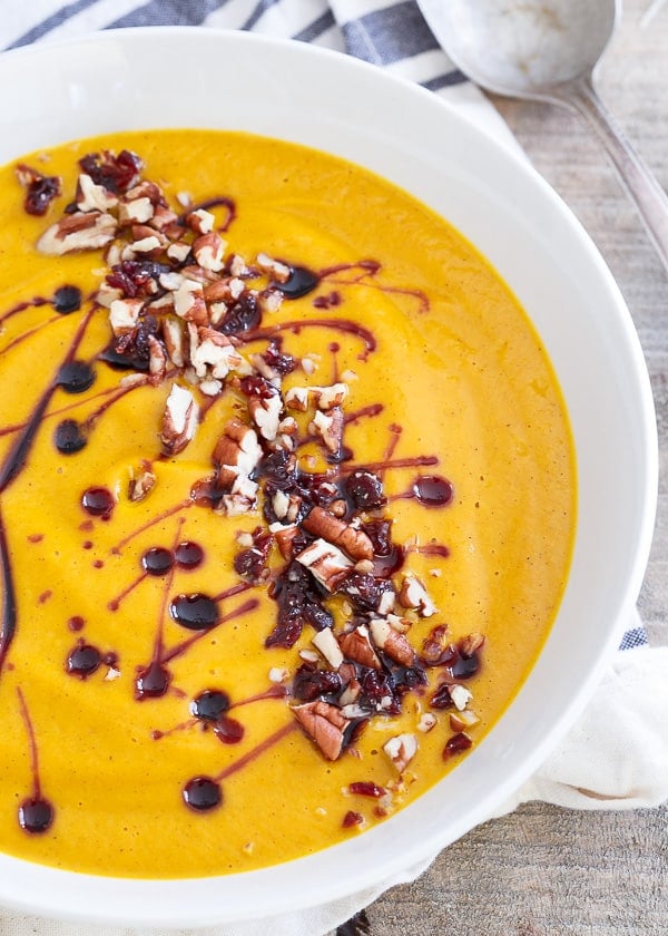 Creamy Kabocha Squash Soup with a Tart Cherry Drizzle and chopped pecans.