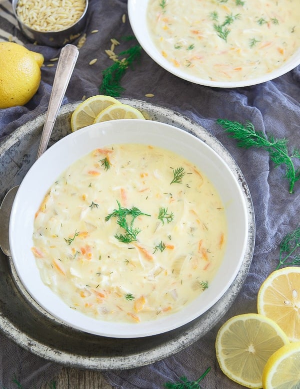 Creamy turkey orzo soup in a large white bowl.