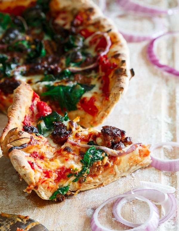 This whole wheat chorizo spinach skillet pizza starts off with a quick homemade tomato sauce and is topped with plenty of fresh cheese, spicy chorizo, spinach and onions. Pizza night just got a whole lot better!