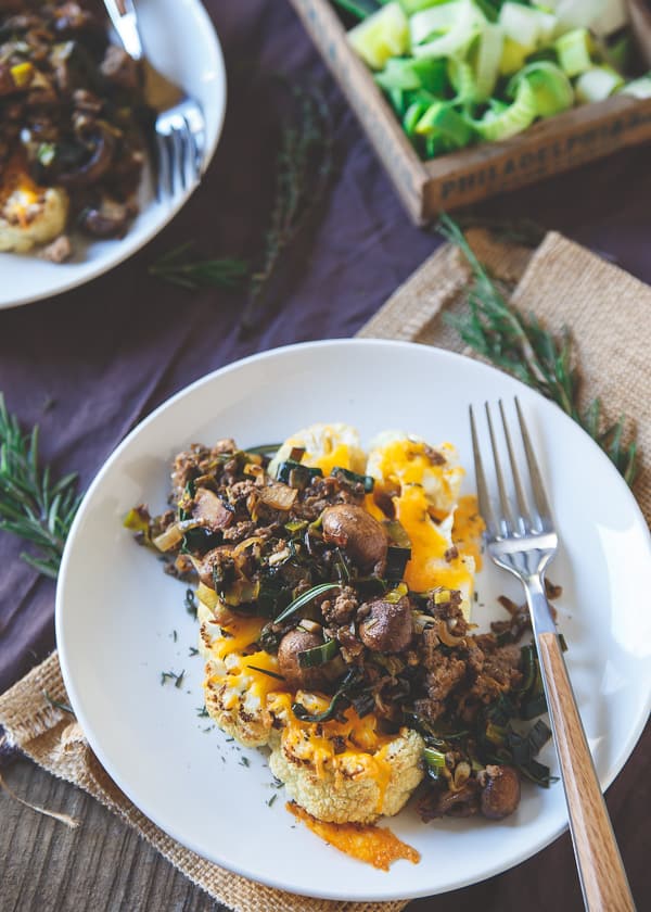 Bison and Cheddar Topped Cauliflower Steaks are healthy comfort food at its best!