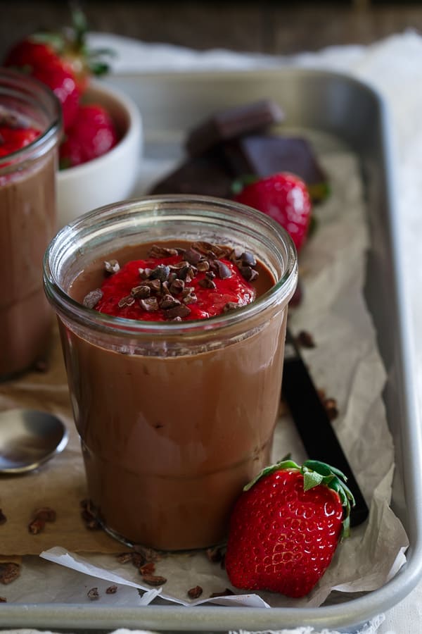 This paleo chocolate mousse is decadent and creamy. It’s topped with a quick strawberry chia sauce for a burst of brightness in each bite.