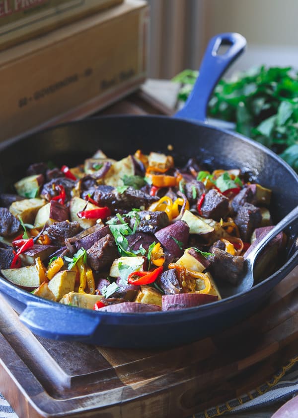 This smoky steak potato and pepper skillet is an easy one-pan dinner, ready in just 40 minutes. Toss everything together in the skillet, stick it in the oven and forget about it!