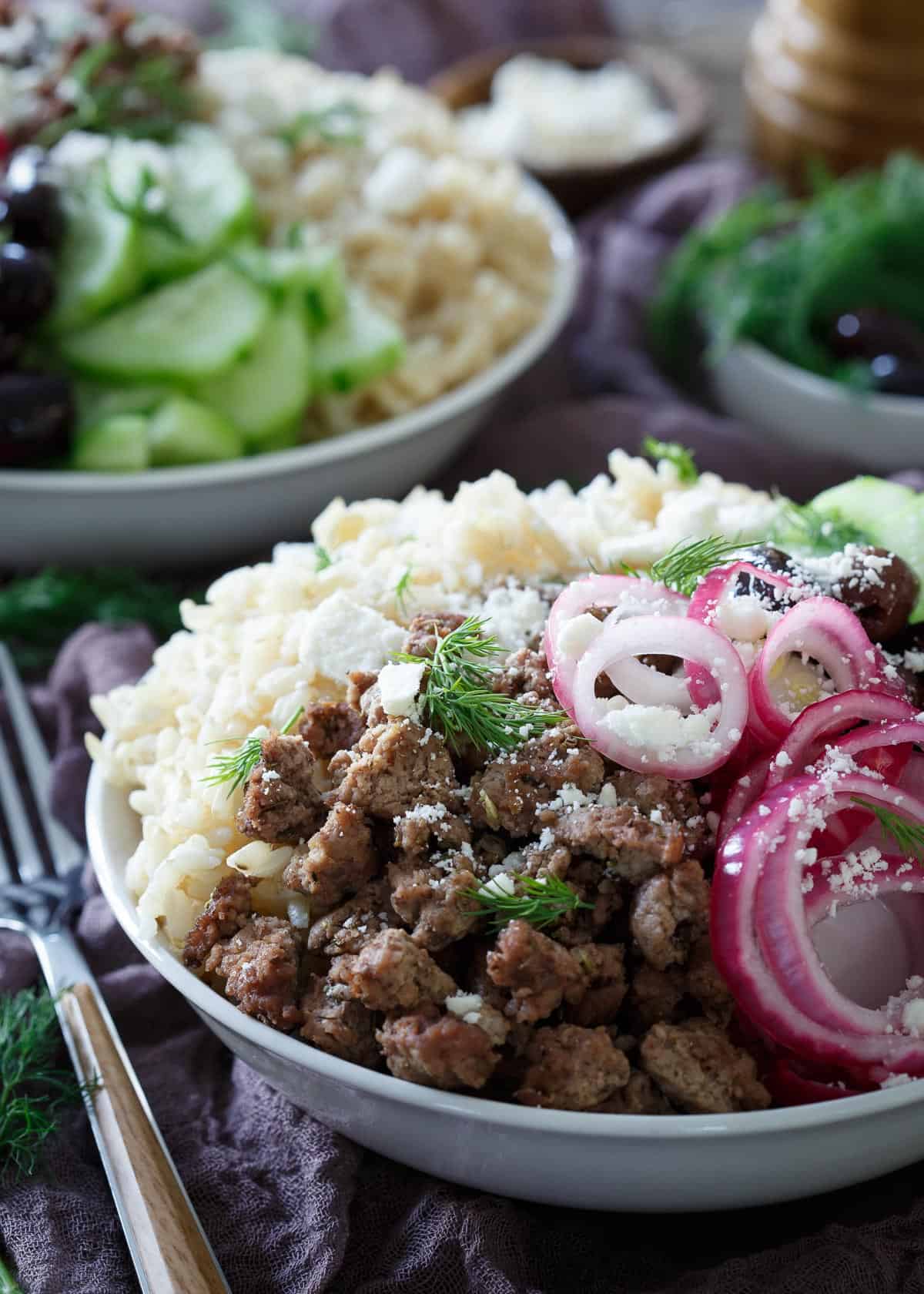 Greek Brown Rice Bowls are filled with everything you love in a Greek salad and a gyro!
