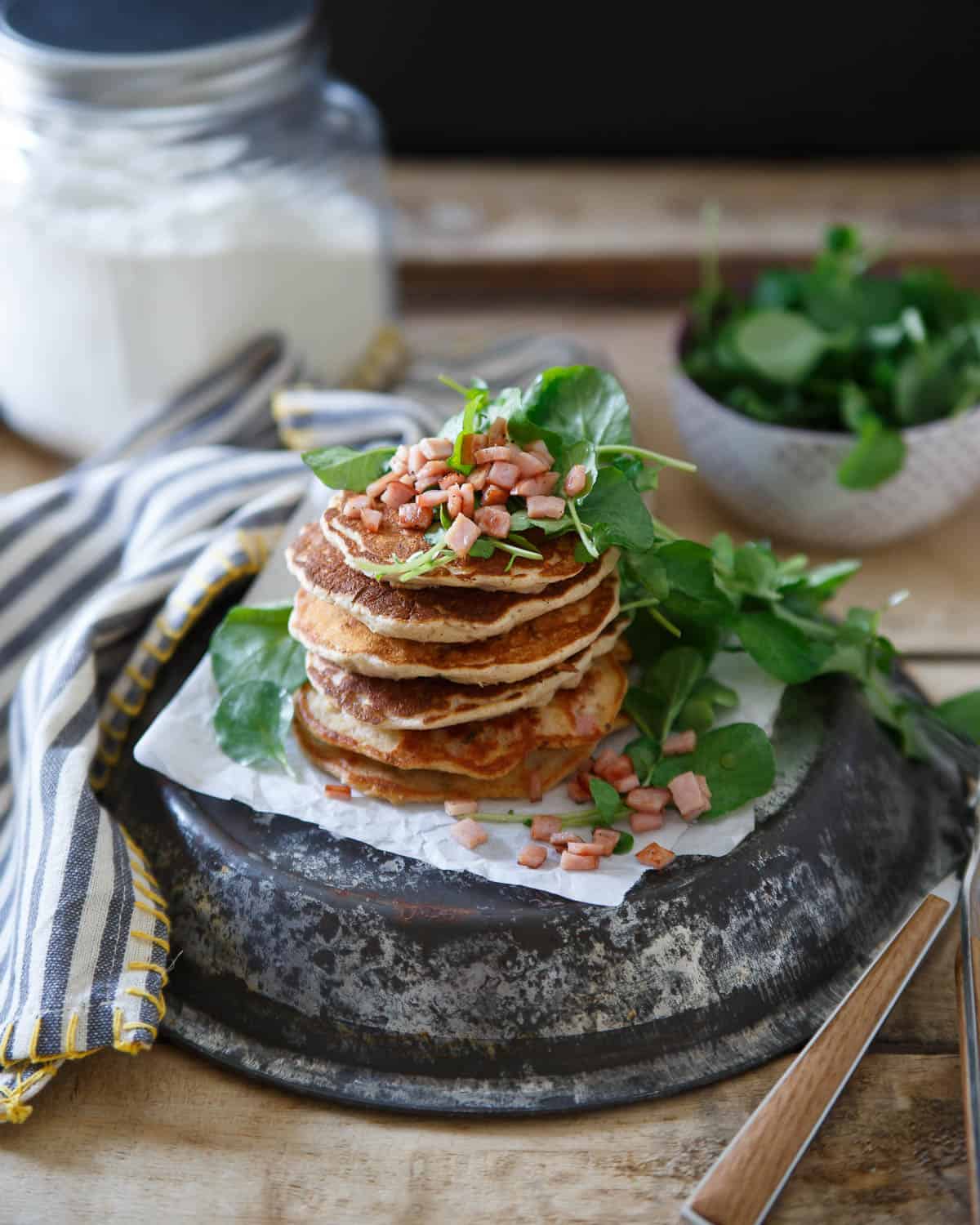 These Canadian bacon pancakes are stuffed full of savory shallots, herbs and Canadian bacon then topped with a crisp watercress salad. Perfect for brinner!