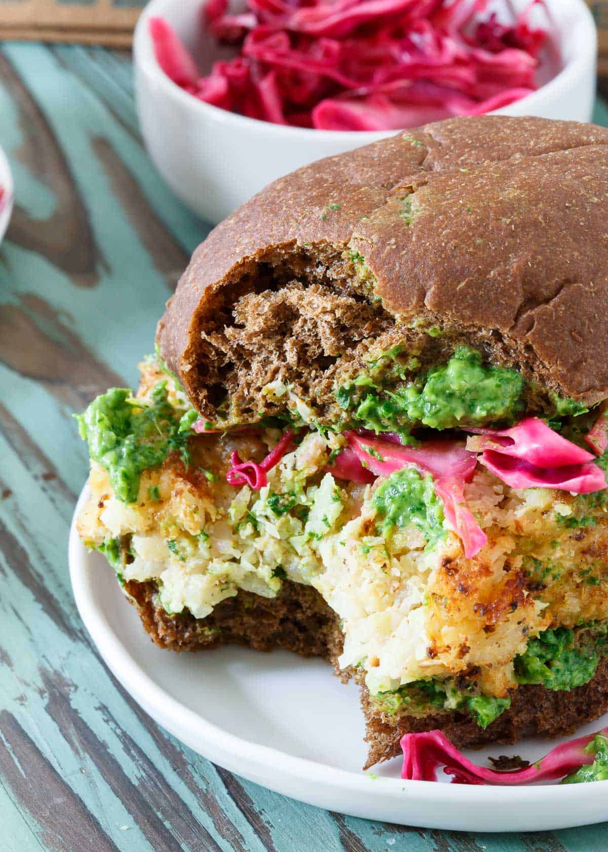 These vegetarian Cauliflower Burgers are stuffed with sharp cheddar cheese an rice for a delicious spin on a veggie burger.