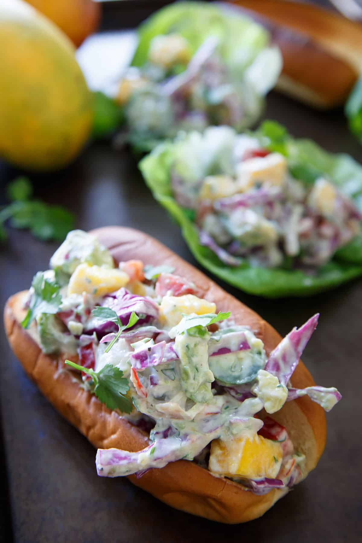 Lobster avocado salad on a toasted bun.