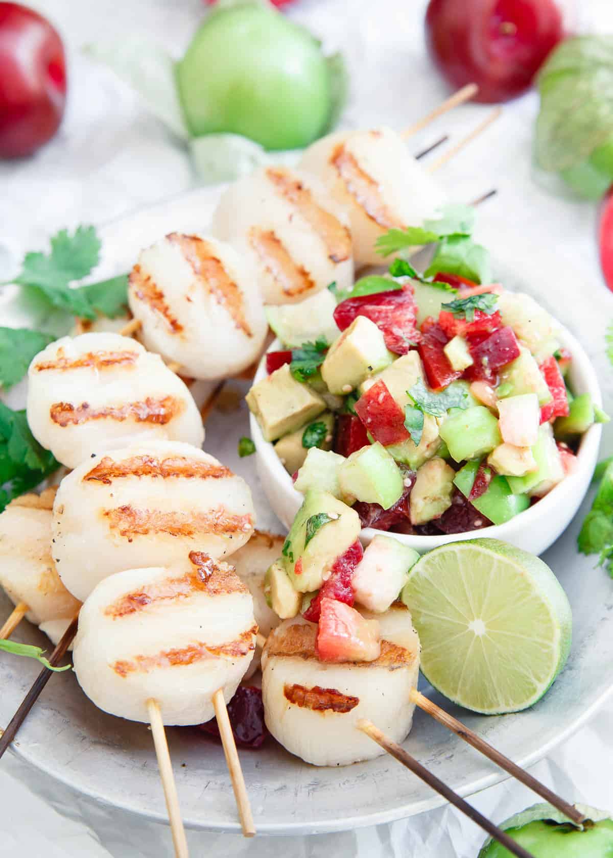 Grilled Scallops with Tomatillo Plum Salsa make a light and delicious summer meal.