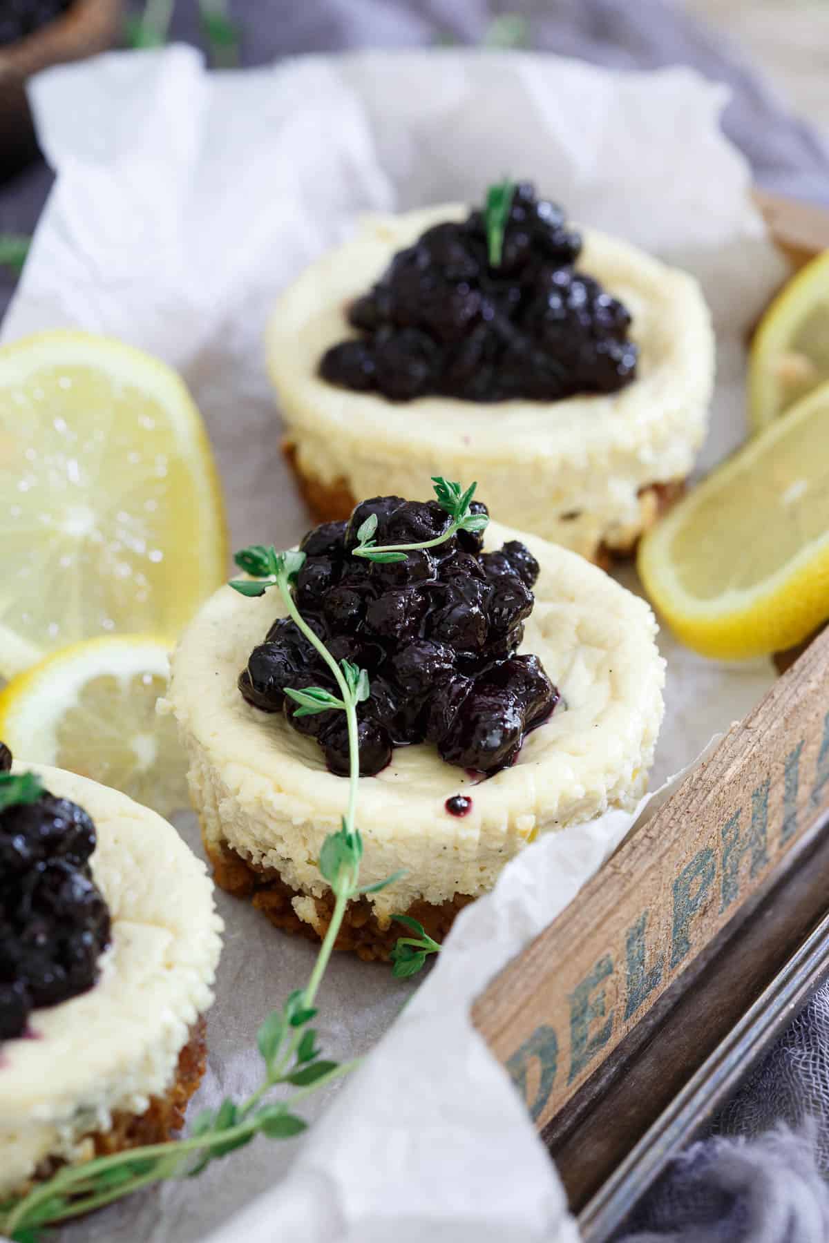 These Lemon Thyme Blueberry Mini Cheesecakes are gluten free and one delicious sweet bite!