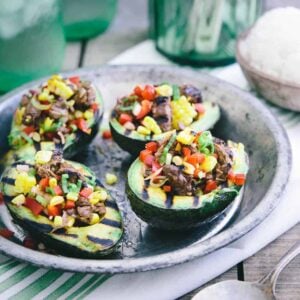 These grilled avocados are stuffed with Asian marinated steak, red peppers, grilled corn and scallions. Serve with a side of rice for a great summer meal!