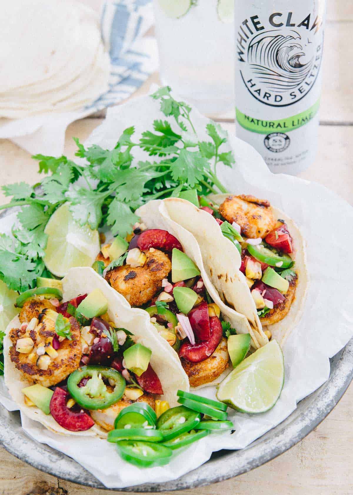 With a simple salsa full of juicy cherries, grilled corn and spicy jalapeÃ±os, these blackened shrimp tacos are a great summer meal. 