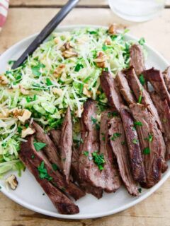 This grilled skirt steak is the perfect summer meal served with a chopped brussels sprouts salad tossed in a lemon dijon dressing.