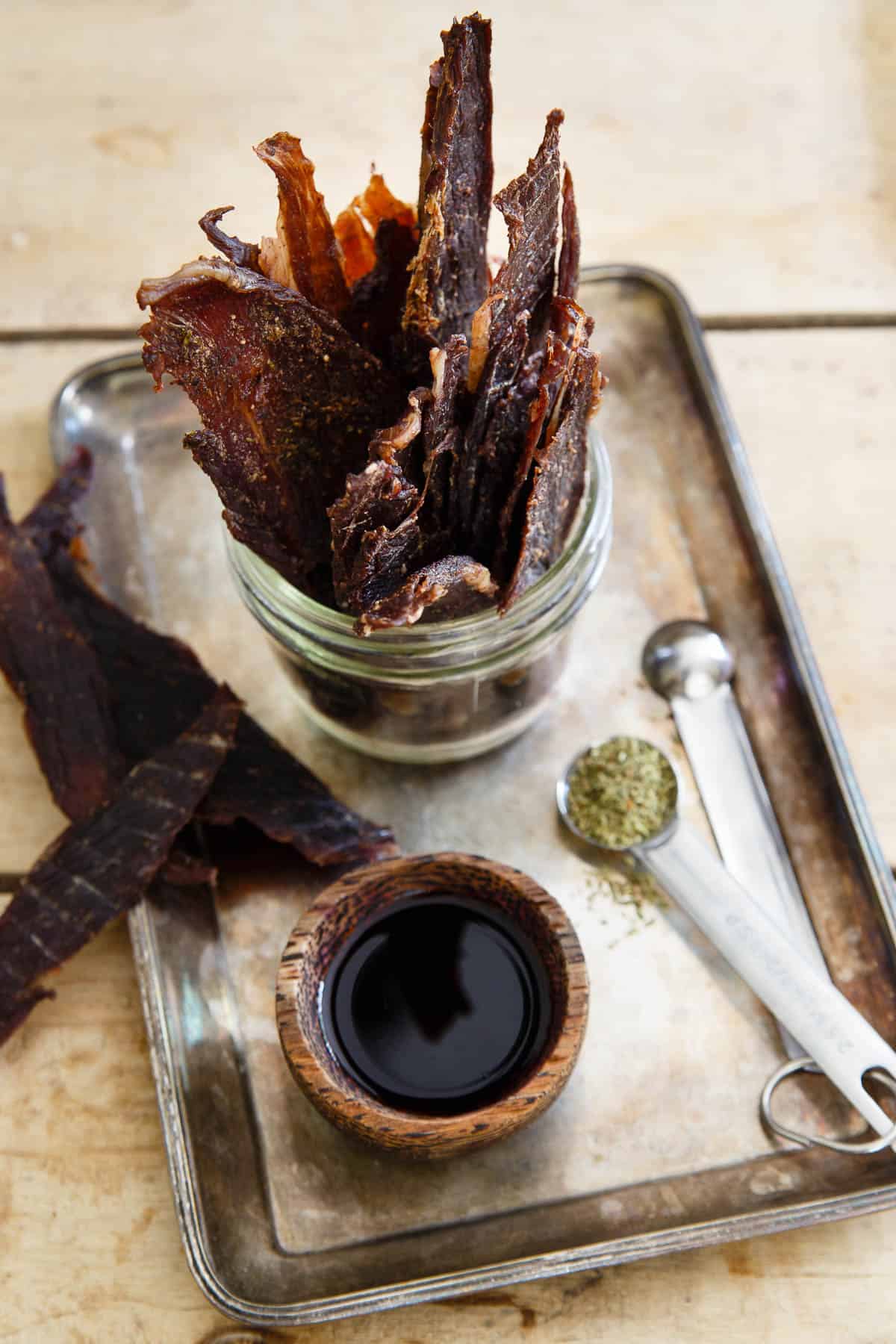 Lamb Jerky seasoned with oregano, garlic, onion, worcestershire and soy sauce is a healthy, high protein snack to keep on hand while out and about.