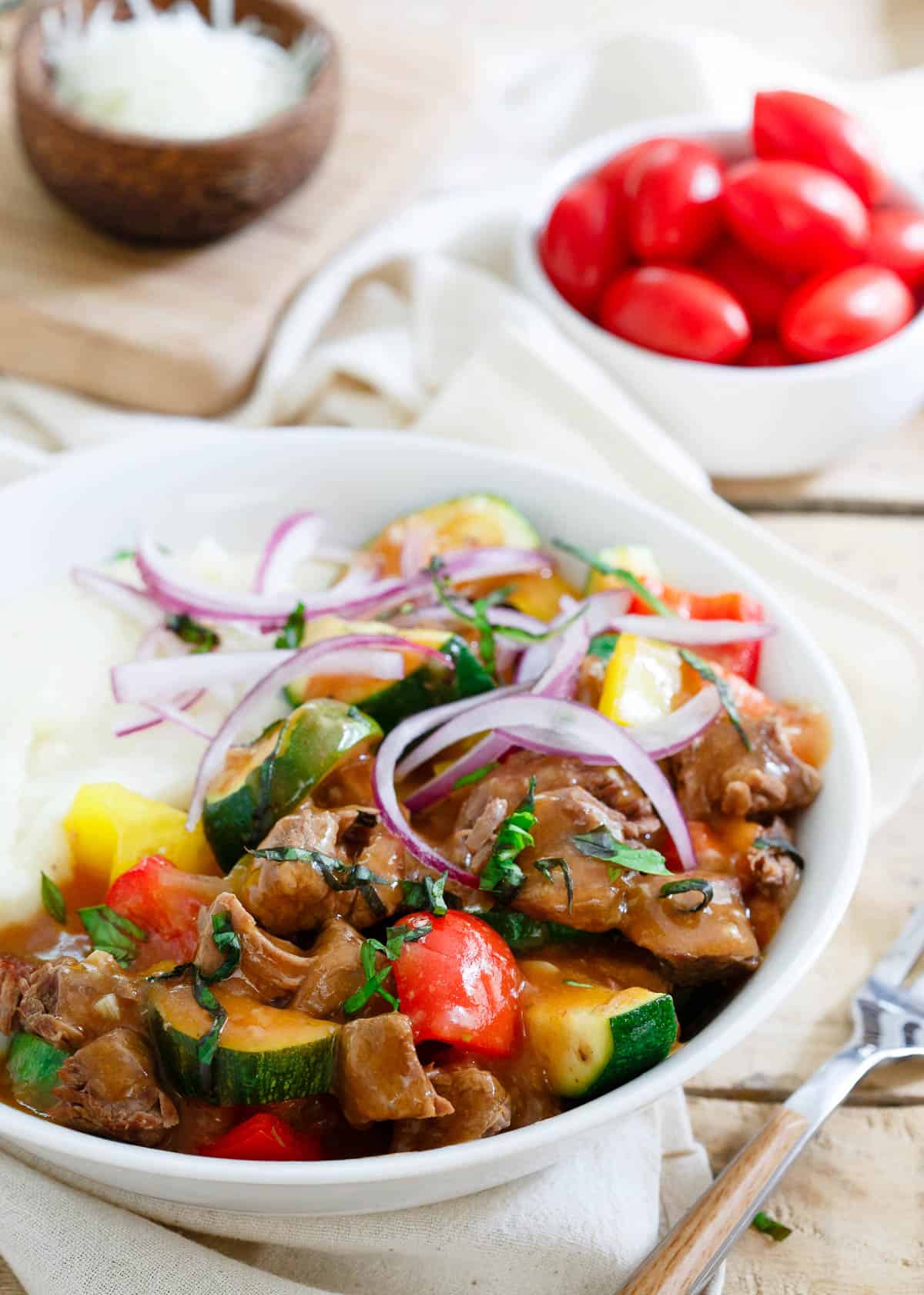 This summer beef stew is made in the slow cooker so the house stays cool. Enjoy this classic dish with a summer vegetable twist!