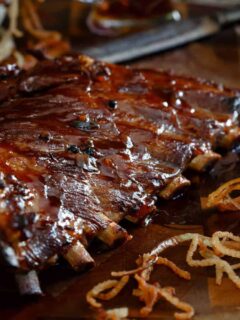 These sticky maple apple ribs are simmered in a maple syrup and apple juice broth then glazed and baked to sticky perfection!