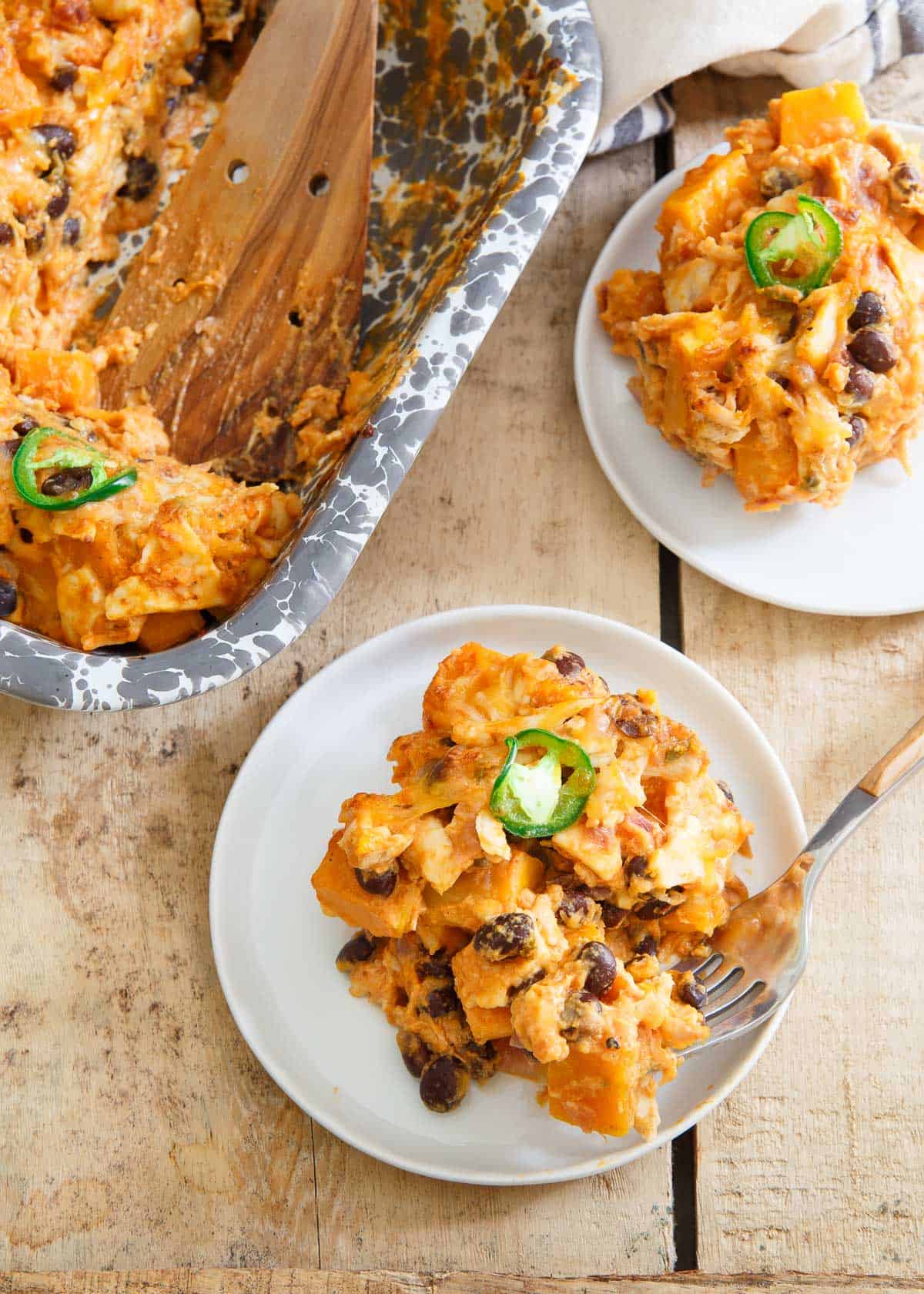 Beaming with fall superfoods, this creamy, cheesy pumpkin tortilla casserole is a great family dinner!
