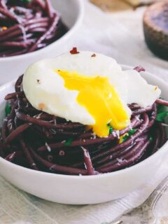 This red wine garlic bucatini is cooked in wine and then sautéed in a red wine garlic sauce. Top it with a soft boiled egg for a stunningly simple dinner.