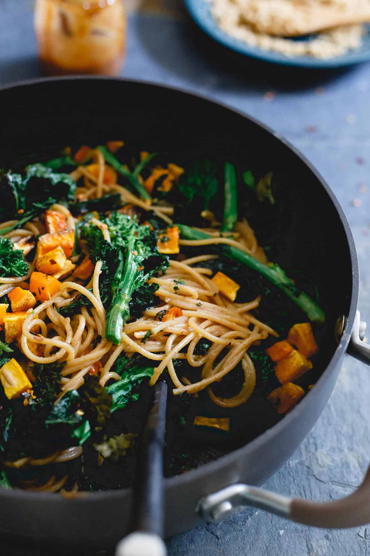 A creamy almond butter sauce is tossed into this fall pasta for an Asian flair with all the coziness of a fall recipe.